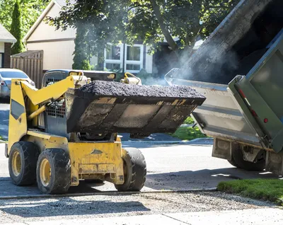 Bobcat resurfacing with hot mix asphalt in Port St Lucie, FL